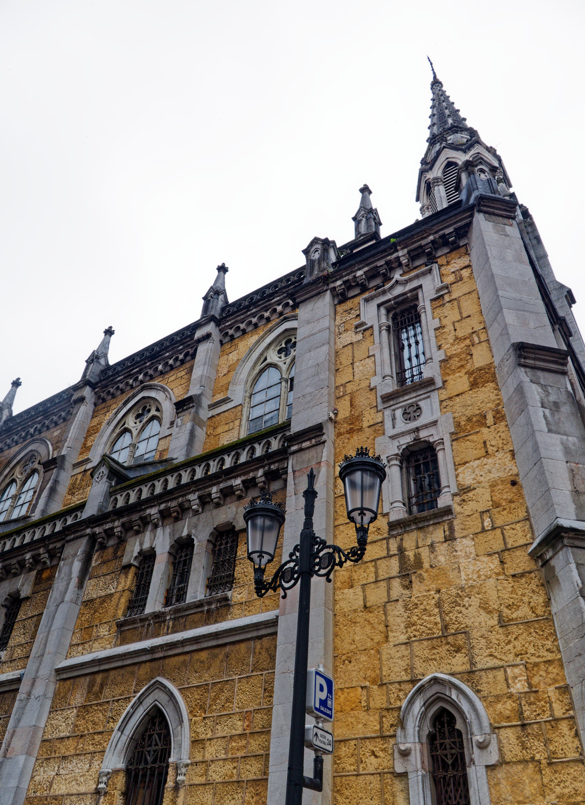 Oviedo sculture of seated man