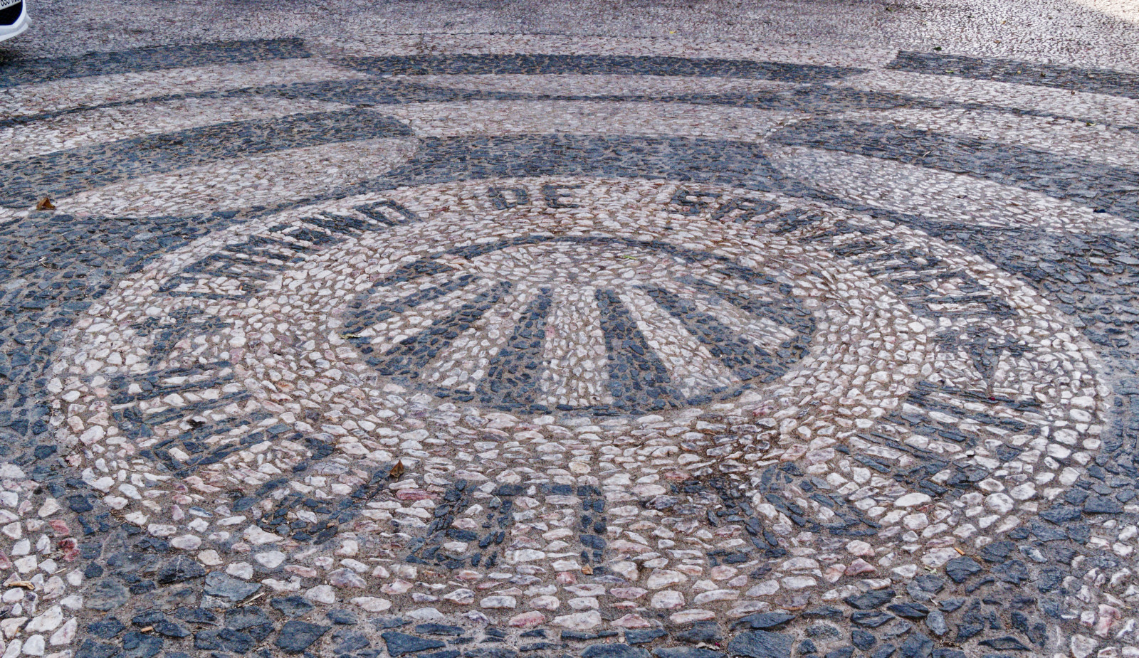 camino sign in the cobbles