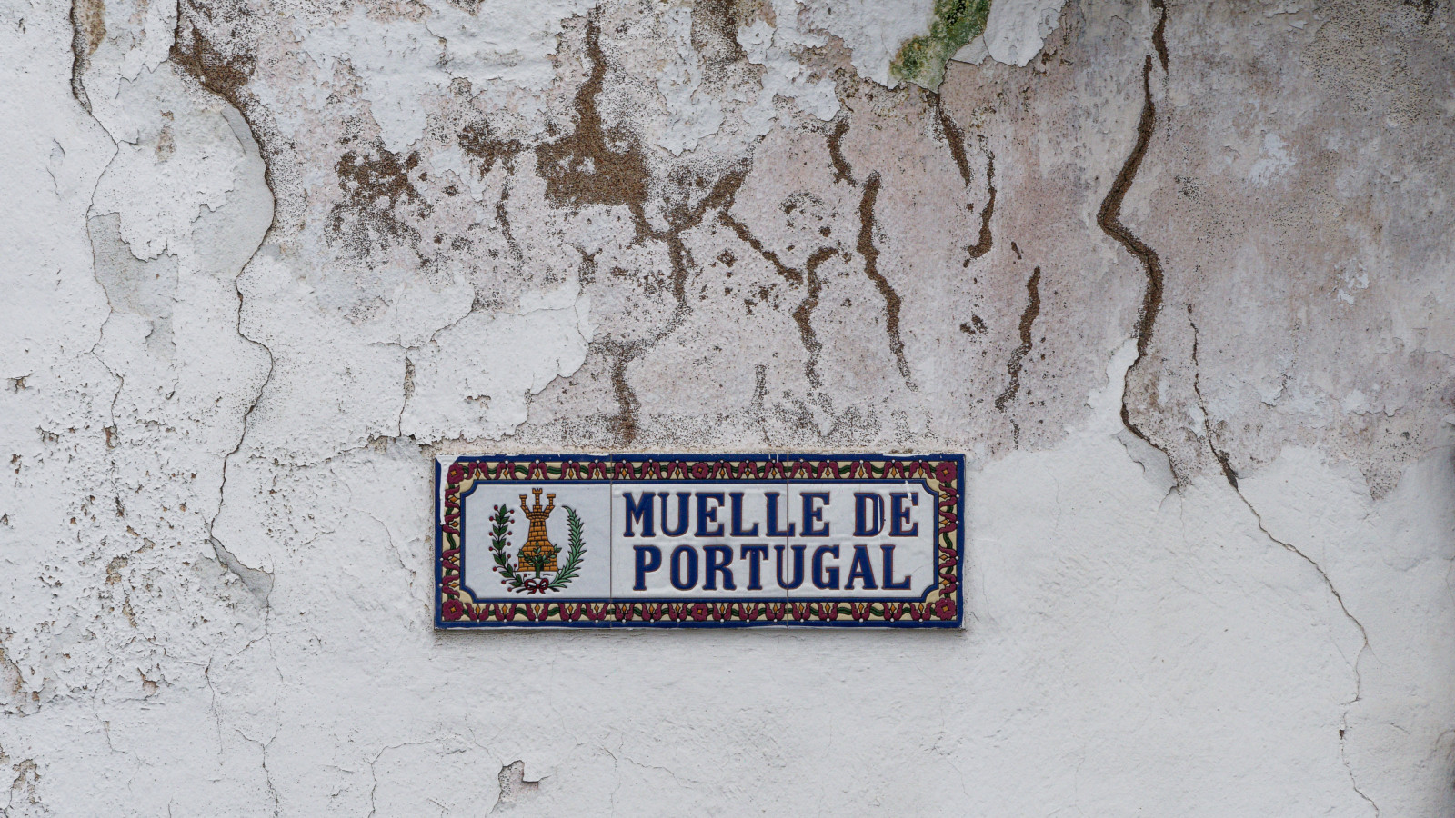 street sign: pier to portugal